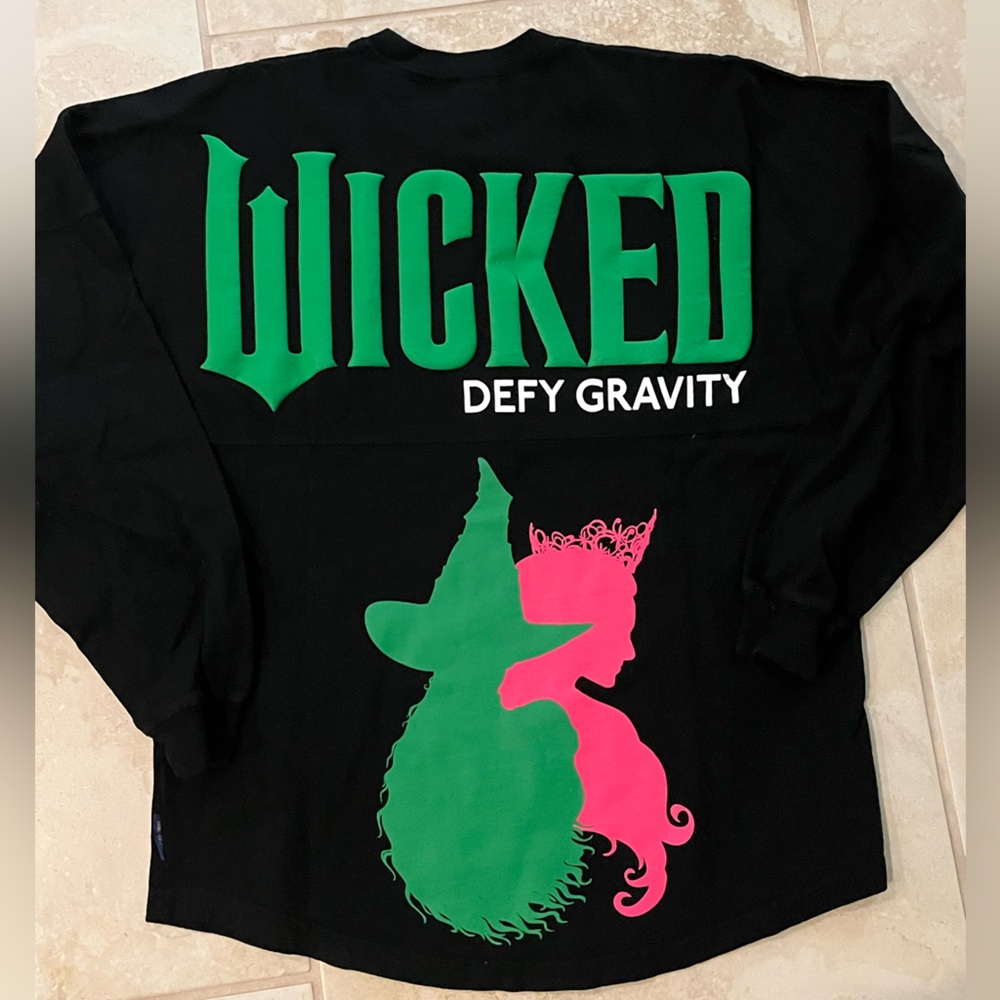 NWOT Wicked Defy Gravity Elphaba and Glinda Spirit Jersey Universal Studios